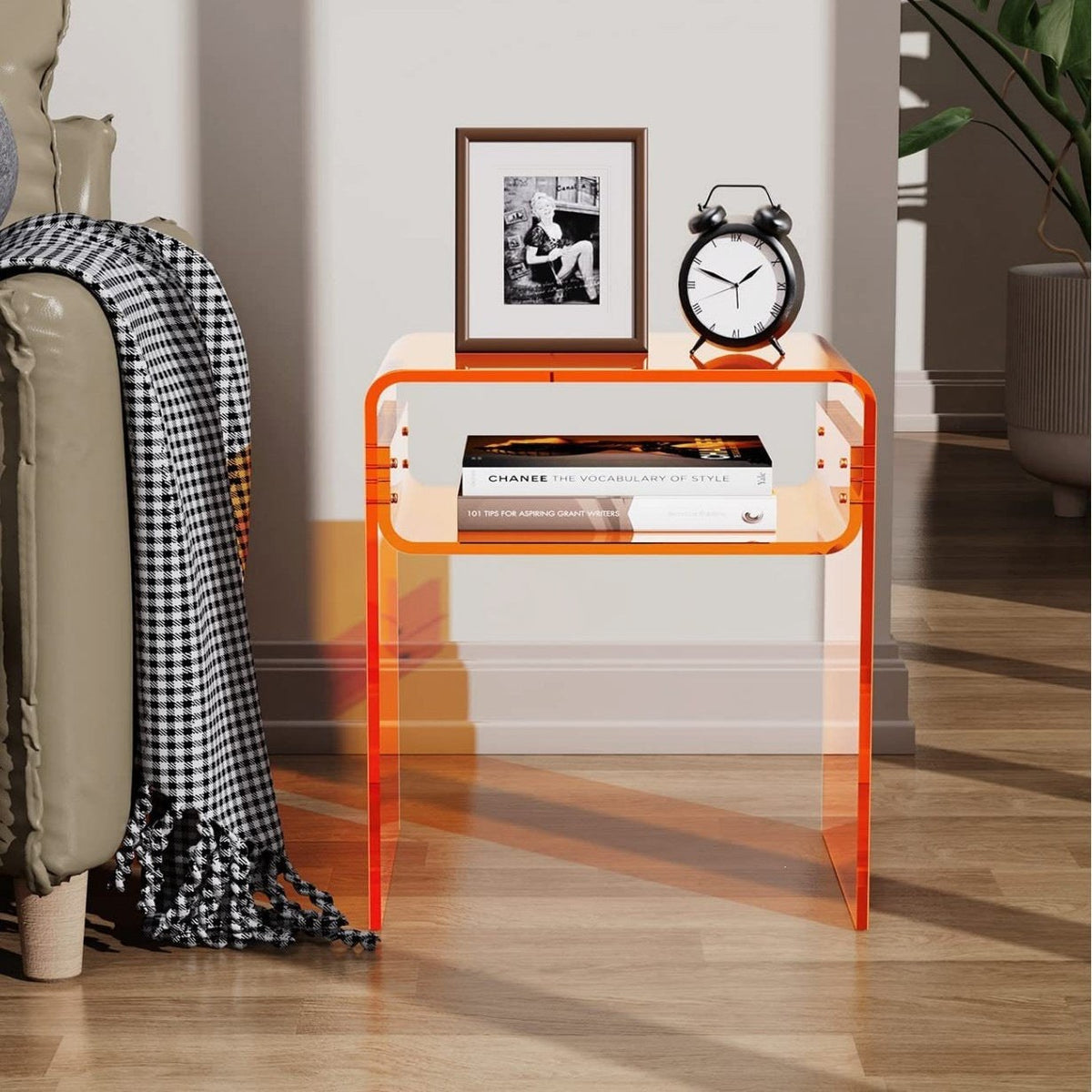 Amber acrylic bedside table in a living space