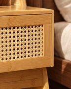 Close-up of the woven rattan drawer front in its bamboo frame