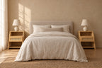 Pair of bamboo and rattan bedside tables on each side of a double bed