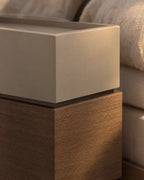 Close-up of the recessed taupe top and the walnut-tone lower section
