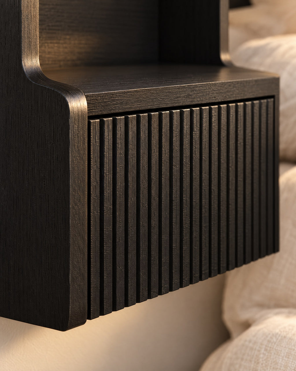 Close-up detail of the black floating bedside table
