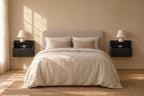 Pair of black floating bedside tables on each side of a double bed