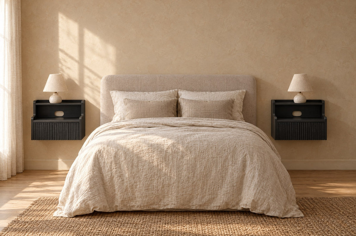 Pair of black floating bedside tables on each side of a double bed