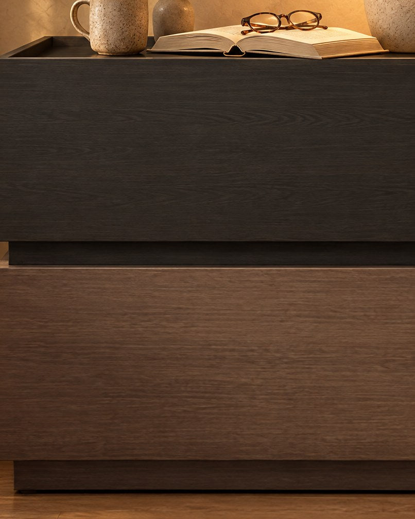 Close-up of the black upper block meeting the walnut-tone lower block