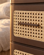Close-up of the cane-effect drawer panel and slim bar handle