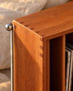 Close-up of the dovetail-style corner joints and chrome leg cap