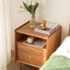Cherry wood bedside table with open niche, product photo in a bedroom