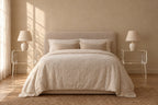 Pair of clear acrylic bedside tables on each side of a double bed