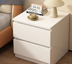 Front view of the compact white bedside table