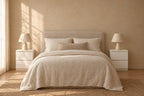 Pair of compact white bedside tables on each side of a double bed