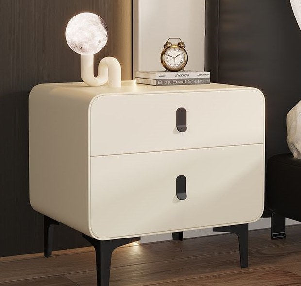 Cream bedside table with black metal legs, product photo