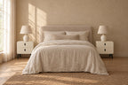 Pair of cream bedside tables with black metal legs on each side of a double bed