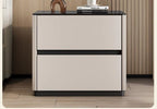 Front view of the cream bedside table with a glossy black top and two drawers