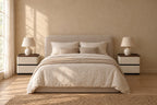 Pair of cream bedside tables with walnut tray tops on each side of a double bed