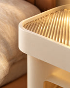 Close-up detail of the cream floating bedside table