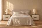 Pair of cream leather-look bedside table with walnut-tone tops on each side of a double bed