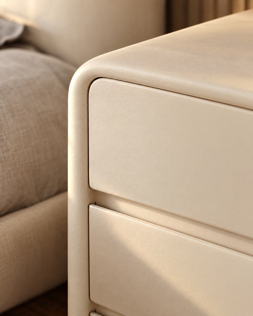 Close-up of the rounded corner of the cream frame and the drawer gap