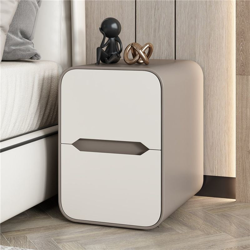 Cream and taupe rounded bedside table in a bedroom