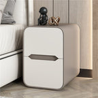 Cream and taupe rounded bedside table in a bedroom