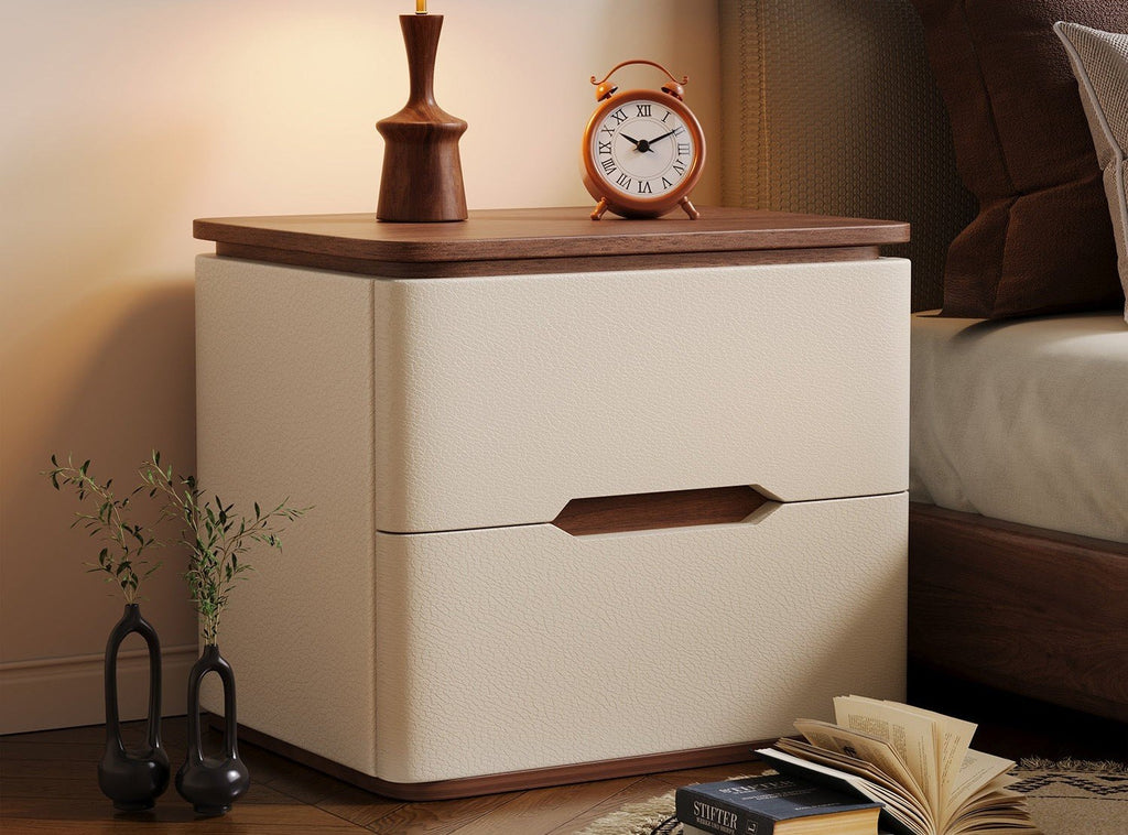 Cream bedside table with a walnut top and an alarm clock beside a bed