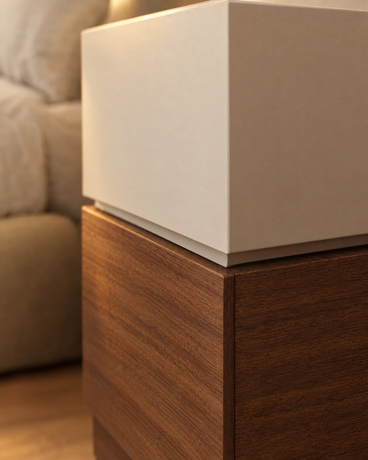 Close-up of the hidden grip between the cream and walnut drawers