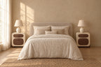 Pair of cream bedside tables with walnut drawer fronts on each side of a double bed