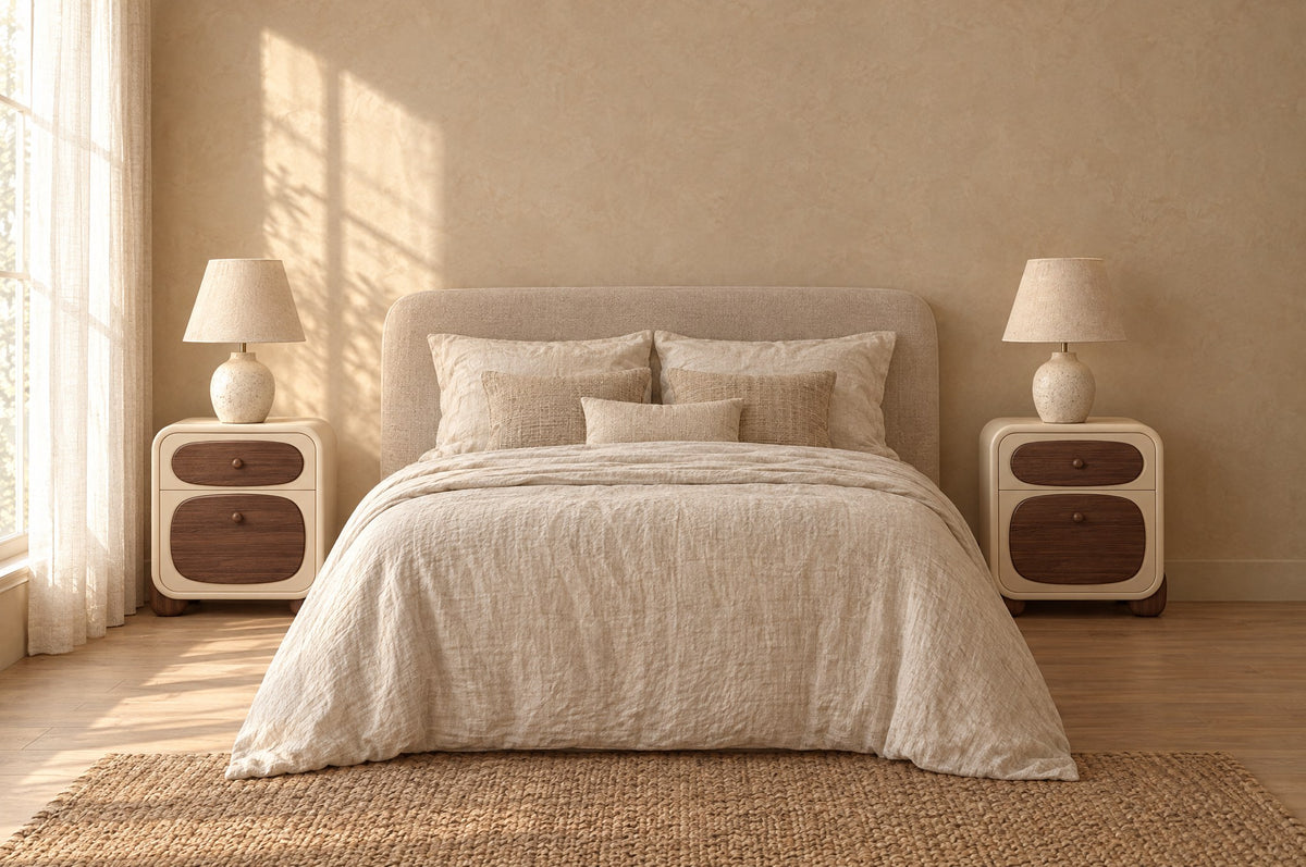 Pair of cream bedside tables with walnut drawer fronts on each side of a double bed