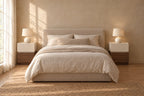 Pair of cream and walnut bedside tables on each side of a double bed