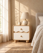 Cream wave bedside table with a ceramic lamp in morning light
