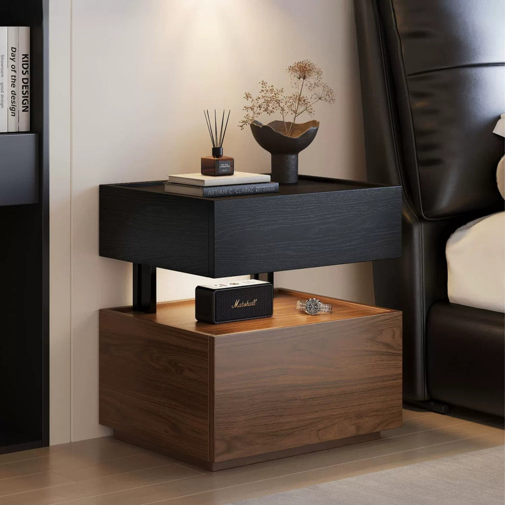 Black and walnut floating bedside table beside a bed