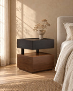 Three-quarter view of the floating bedside table showing the open gap between the drawers
