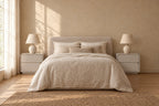 Pair of greige lacquered bedside tables on each side of a double bed