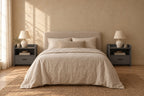 Pair of grey bedside tables with an open shelf and one drawer on each side of a double bed
