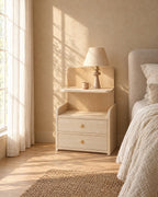 Pale wood bedside table with two drawers in morning light