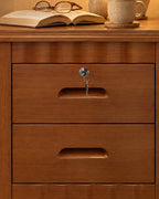 Close-up of the key lock and carved finger pull on the top drawer