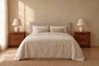 Pair of mahogany-tone wood bedside tables with 2 drawers on each side of a double bed