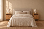 Pair of narrow natural bamboo bedside tables on each side of a double bed