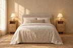 Pair of narrow natural wood bedside tables on each side of a double bed