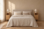 Pair of narrow oak bedside tables on each side of a double bed