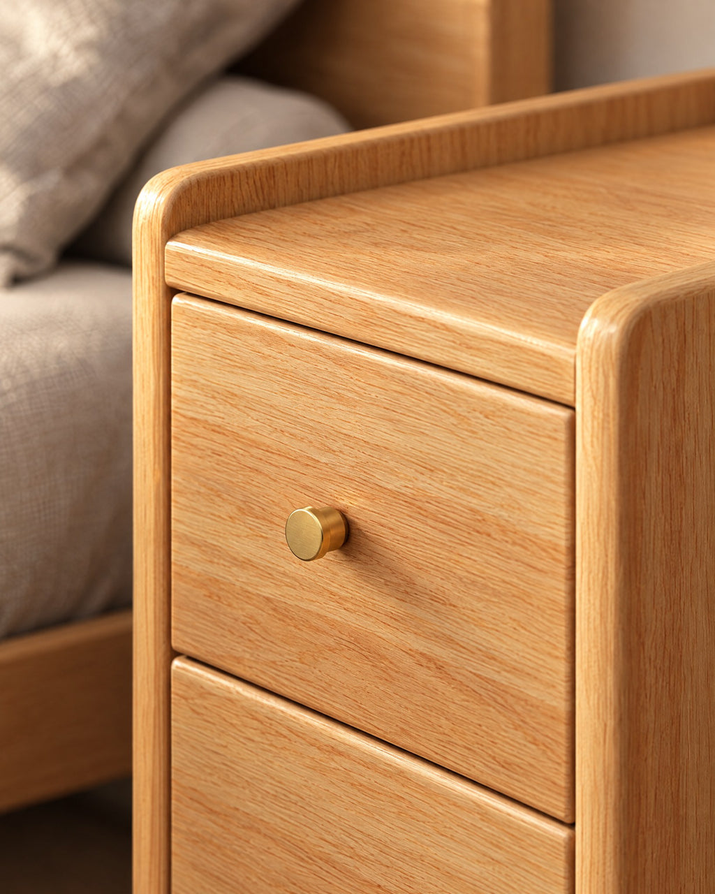 Close-up of the gold knob and the raised lip of the oak-effect top