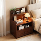 Narrow walnut bedside table with a raised shelf, open cubby and one drawer