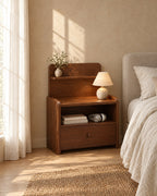 Walnut bedside table with a raised shelf and open cubby in morning light