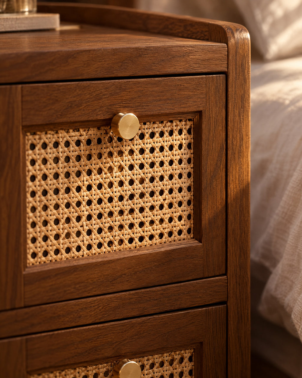 Close-up of the rattan cane drawer front with its brass knob