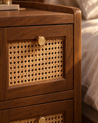 Close-up of the rattan cane drawer front with its brass knob