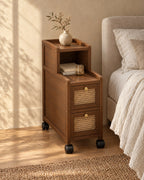 Three-quarter view of the narrow walnut bedside cabinet on wheels