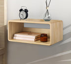 Natural wood floating bedside shelf in a bedroom