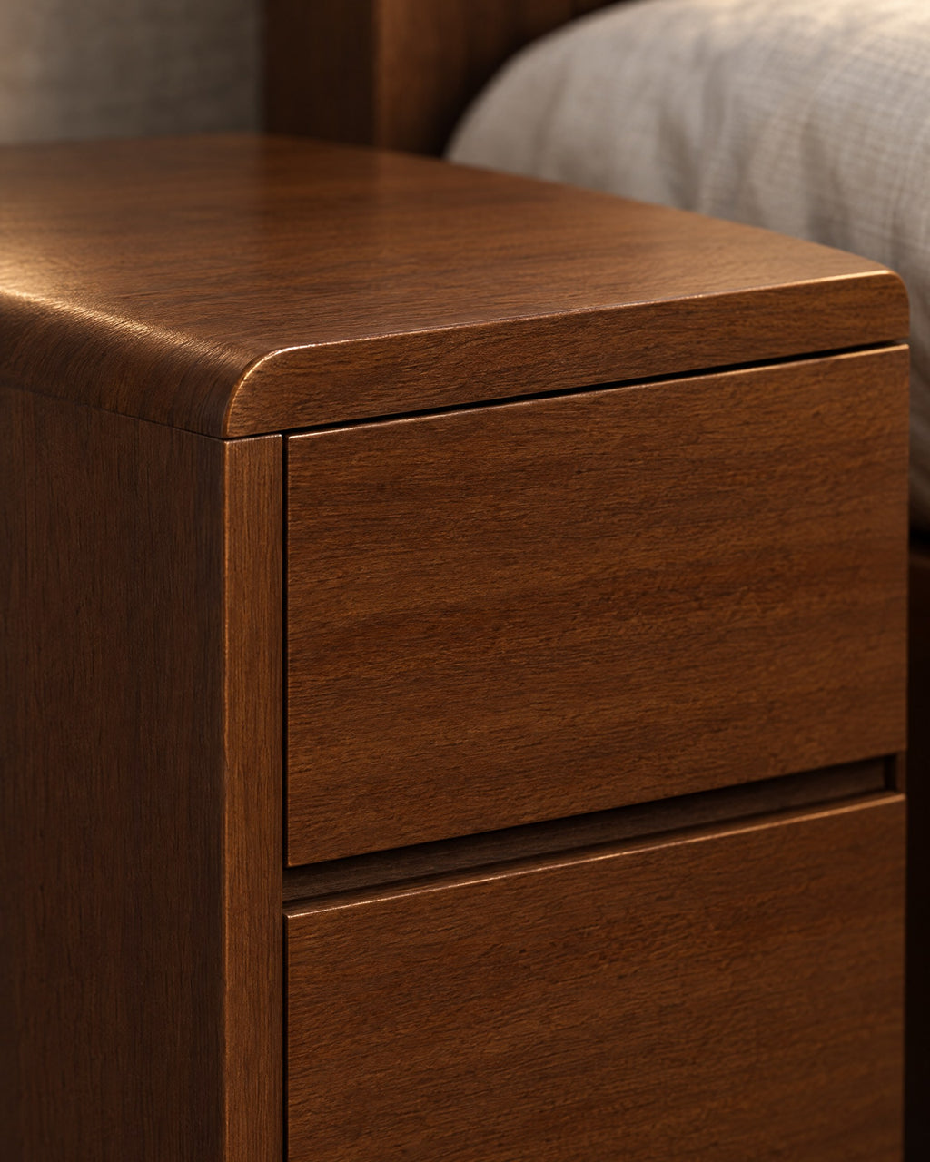Close-up detail of the Nordic walnut bedside table with two handle-free drawers