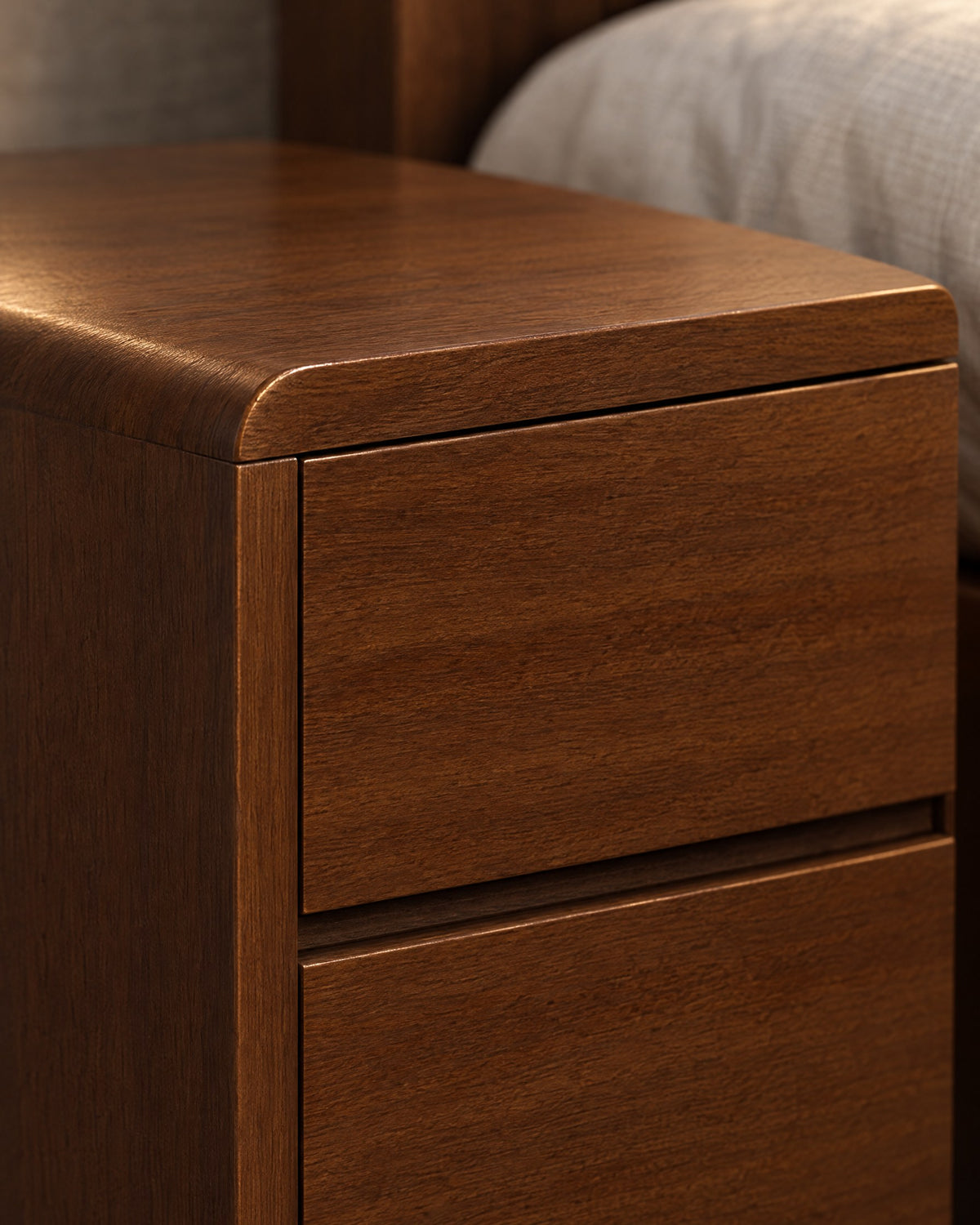 Close-up detail of the Nordic walnut bedside table with two handle-free drawers
