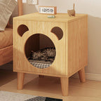 Oak bear bedside table with a cat sleeping in the pet nook