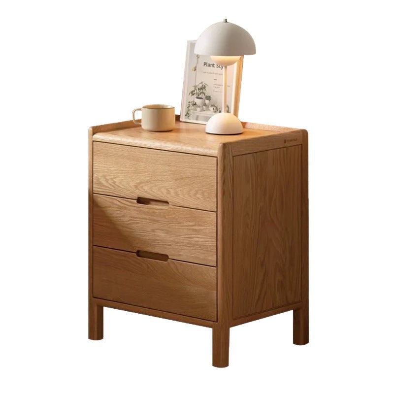 Front view of the oak bedside table with three drawers